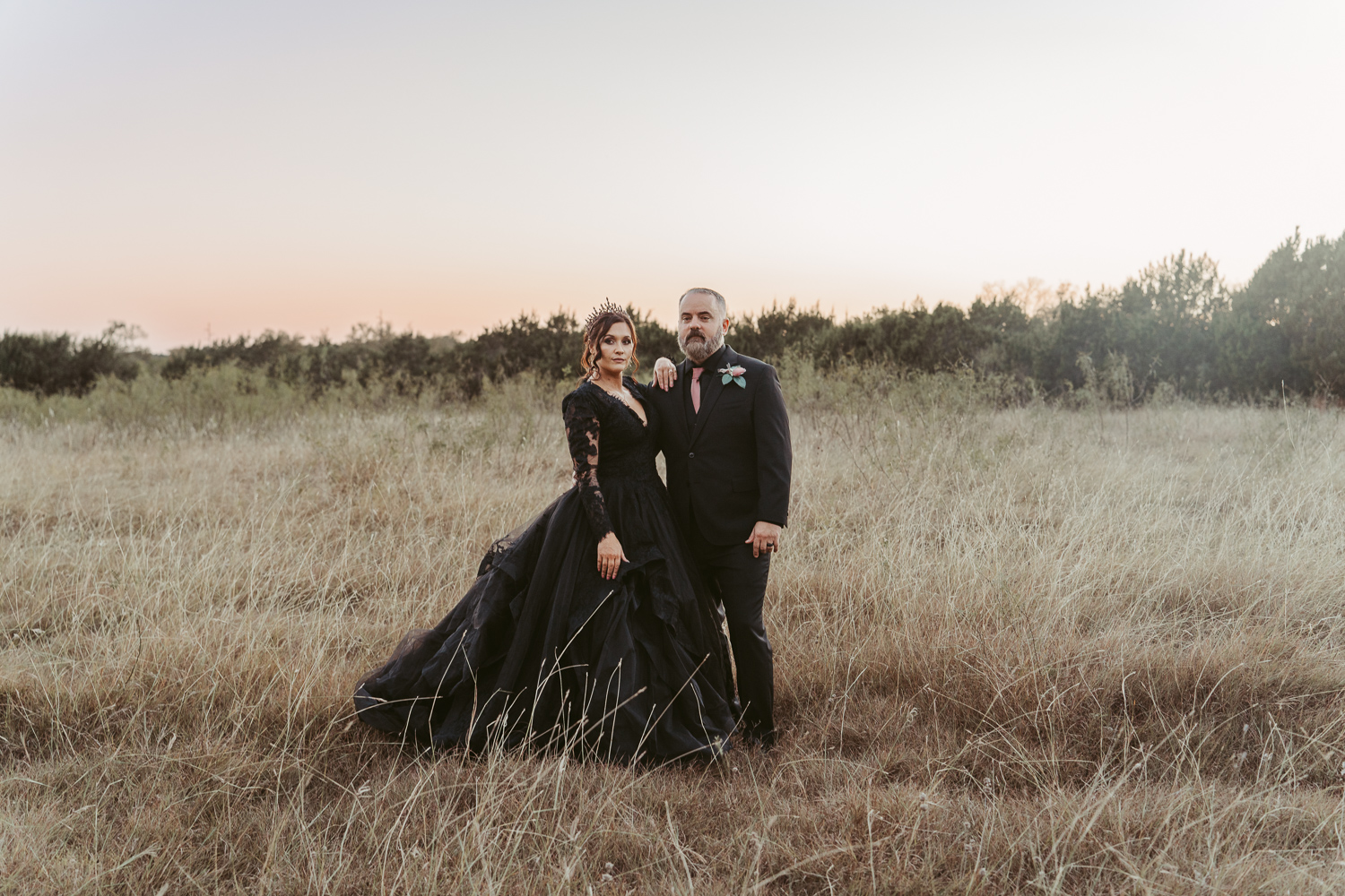 A couple dressed in all black on their Halloween wedding day, embracing gothic romance and alternative wedding vibes.
